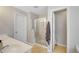Bright bathroom with double sinks, glass shower, and tile flooring at 451 Tioram Se Ln, Smyrna, GA 30082