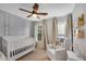 Charming Bedroom with a crib, chair, and natural light from two windows at 451 Tioram Se Ln, Smyrna, GA 30082