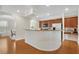 Spacious kitchen features modern appliances, wood floors, and breakfast bar perfect for entertaining at 451 Tioram Se Ln, Smyrna, GA 30082