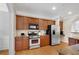 Spacious kitchen featuring stainless steel appliances and ample cabinet space at 451 Tioram Se Ln, Smyrna, GA 30082