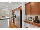 Kitchen with stainless steel refrigerator and built in coffee/breakfast bar at 451 Tioram Se Ln, Smyrna, GA 30082