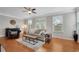 Comfortable living room with lots of light and hardwood floors at 451 Tioram Se Ln, Smyrna, GA 30082