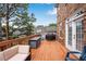 This outdoor deck space has seating, a grill, and backyard views at 451 Tioram Se Ln, Smyrna, GA 30082