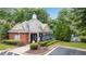 Exterior view of community pool house with brick siding and gated access at 451 Tioram Se Ln, Smyrna, GA 30082