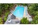 Aerial view of a large rectangular swimming pool surrounded by lounge chairs at 451 Tioram Se Ln, Smyrna, GA 30082