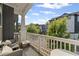 Relaxing balcony with seating area and views of the neighborhood and blue skies at 518 Hargrove Ln, Decatur, GA 30030