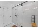 Elegant walk-in shower features white subway tile, glass enclosure, and dual shower heads at 518 Hargrove Ln, Decatur, GA 30030