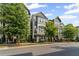 Stylish townhome featuring a second-story balcony, manicured landscaping, and an inviting facade at 518 Hargrove Ln, Decatur, GA 30030
