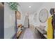 Bright foyer featuring a staircase, hardwood floors, and a decorative mirror at 518 Hargrove Ln, Decatur, GA 30030