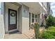 Inviting front entrance with wreath, painted brick, and a charming covered porch at 518 Hargrove Ln, Decatur, GA 30030