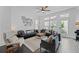 Bright, inviting living room featuring hardwood floors, lots of windows, and comfortable furniture at 518 Hargrove Ln, Decatur, GA 30030