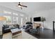 Bright living room with a ceiling fan, dark hardwood floors, a piano, and lots of natural light at 518 Hargrove Ln, Decatur, GA 30030