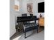 Cozy living room featuring a sleek Yamaha piano and comfortable seating at 518 Hargrove Ln, Decatur, GA 30030