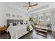 Spacious main bedroom featuring a tray ceiling, hardwood floors, and lots of natural light at 518 Hargrove Ln, Decatur, GA 30030