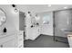 Bright bathroom featuring dual vanities, a tiled shower, and modern fixtures at 1536 Daffodil Drive, Marietta, GA 30062