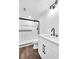 Contemporary bathroom with a glass shower, white vanity, and black fixtures at 1536 Daffodil Drive, Marietta, GA 30062