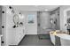 Modern bathroom features a walk-in shower and soaking tub with black fixtures at 1536 Daffodil Drive, Marietta, GA 30062