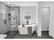 Bright bathroom with sleek, modern fixtures and a freestanding tub at 1536 Daffodil Drive, Marietta, GA 30062