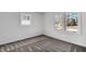 Bright, empty bedroom with carpet floors and windows providing natural light at 1536 Daffodil Drive, Marietta, GA 30062