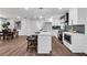 Modern kitchen with a center island, white cabinets, and stainless steel appliances at 1536 Daffodil Drive, Marietta, GA 30062