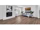 Bright living room with a brick fireplace, hardwood floors, and stylish decor at 1536 Daffodil Drive, Marietta, GA 30062