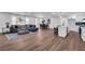 Open-concept living area with hardwood floors, modern lighting, and a spacious seating area at 1536 Daffodil Drive, Marietta, GA 30062