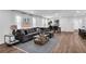 Spacious living room with hardwood floors, a large sectional sofa, and ample natural light at 1536 Daffodil Drive, Marietta, GA 30062
