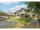 The backyard features mature trees and a custom patio ideal for outdoor enjoyment at 9811 Spyglass Dr, Villa Rica, GA 30180