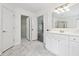 Bright bathroom featuring tile flooring, double sinks, and walk-in closet at 9811 Spyglass Dr, Villa Rica, GA 30180