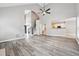 Bright living room featuring hardwood floors, soaring ceilings, and an open floor plan at 9811 Spyglass Dr, Villa Rica, GA 30180