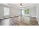 The main bedroom features a trey ceiling, fan, and large windows at 9811 Spyglass Dr, Villa Rica, GA 30180