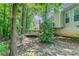Backyard view of the home with mature trees, a deck and siding at 12015 Harbour Town Pkwy, Fayetteville, GA 30215