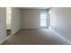 Neutral-painted bedroom featuring wall-to-wall carpeting, base molding and natural light at 12015 Harbour Town Pkwy, Fayetteville, GA 30215