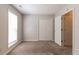 Cozy bedroom with a double door closet, neutral walls, and a bright window at 12015 Harbour Town Pkwy, Fayetteville, GA 30215