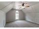 Spacious bonus room featuring carpet, a large window for natural light, and ample space at 12015 Harbour Town Pkwy, Fayetteville, GA 30215