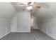 Open bonus room offering flexible space, carpet flooring, with access to other parts of the house at 12015 Harbour Town Pkwy, Fayetteville, GA 30215