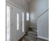 Welcoming entryway with a decorative front door and view of the staircase at 12015 Harbour Town Pkwy, Fayetteville, GA 30215