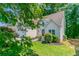 Charming home featuring a well-kept lawn and manicured shrubbery at 12015 Harbour Town Pkwy, Fayetteville, GA 30215