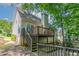 Exterior view of home with a wooden deck, chimney and a siding exterior at 12015 Harbour Town Pkwy, Fayetteville, GA 30215