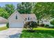 Charming home with a well-maintained front yard and a two-car garage at 12015 Harbour Town Pkwy, Fayetteville, GA 30215