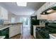 Well-lit kitchen with modern appliances and a view of the dining area at 12015 Harbour Town Pkwy, Fayetteville, GA 30215