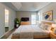 Comfortable main bedroom featuring neutral paint and furniture at 12015 Harbour Town Pkwy, Fayetteville, GA 30215