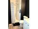 Modern bathroom with a walk-in shower, black accent wall, and updated vanity at 210 Mill Creek Pl, Roswell, GA 30076