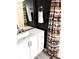Bathroom vanity with white cabinets, gray floor and bear themed curtain at 210 Mill Creek Pl, Roswell, GA 30076