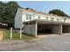 Exterior view of apartments with parking and mailboxes at 210 Mill Creek Pl, Roswell, GA 30076