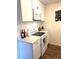Kitchen featuring white cabinets, countertops, and stainless steel appliances at 210 Mill Creek Pl, Roswell, GA 30076