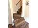 Interior stairway with wood steps and railing at 210 Mill Creek Pl, Roswell, GA 30076