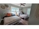Bright bedroom with twin beds, ceiling fan, neutral walls, and hardwood floors at 462 Center Hill Ave, Atlanta, GA 30318