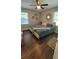Inviting primary bedroom with natural light, modern decor, a ceiling fan, and wooden floors at 462 Center Hill Ave, Atlanta, GA 30318