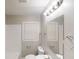 Classic bathroom featuring a vanity, toilet, mirror, and window for natural light at 568 Mcwilliams Se Rd, Atlanta, GA 30315